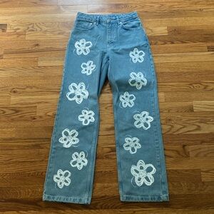 jeans with white painted flower detail